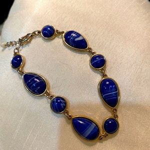 NRQ gold-tone bracelet with blue “star” stone (see matching necklace & earrings)